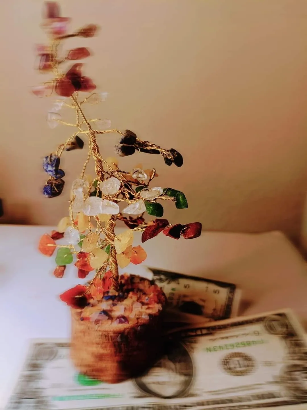 A tree made of candy sitting on top of a table.